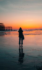 Preview wallpaper silhouette, alone, beach, sea, sunset, dark