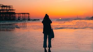 Preview wallpaper silhouette, alone, beach, sea, sunset, dark