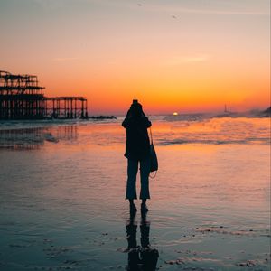 Preview wallpaper silhouette, alone, beach, sea, sunset, dark