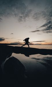 Preview wallpaper silhouette, alone, coast, sea, twilight, dark