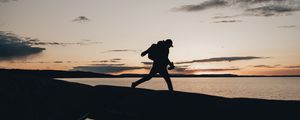 Preview wallpaper silhouette, alone, coast, sea, twilight, dark