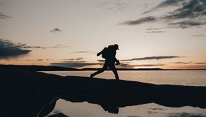 Preview wallpaper silhouette, alone, coast, sea, twilight, dark