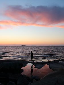 Preview wallpaper silhouette, alone, coast, sea, dark, twilight