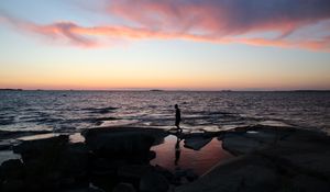 Preview wallpaper silhouette, alone, coast, sea, dark, twilight