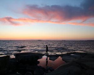 Preview wallpaper silhouette, alone, coast, sea, dark, twilight