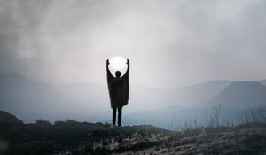 Preview wallpaper silhouette, alone, gesture, moon, mountains
