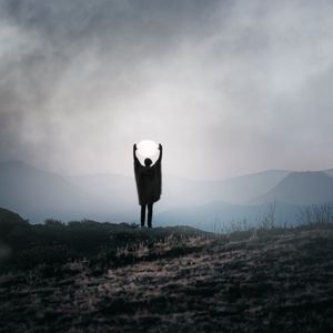 Preview wallpaper silhouette, alone, gesture, moon, mountains