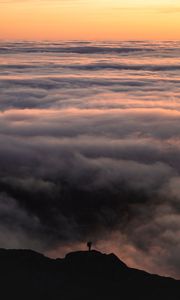 Preview wallpaper silhouette, alone, mountain, peak, clouds