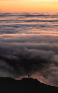 Preview wallpaper silhouette, alone, mountain, peak, clouds