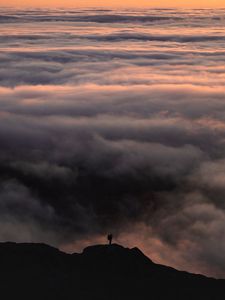 Preview wallpaper silhouette, alone, mountain, peak, clouds