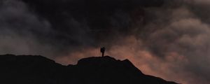 Preview wallpaper silhouette, alone, mountain, peak, clouds