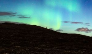 Preview wallpaper silhouette, alone, northern lights, night, dark