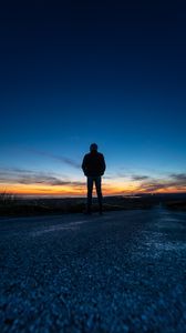 Preview wallpaper silhouette, alone, road, sunset, dark