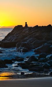 Preview wallpaper silhouette, alone, rocks, sea, horizon, sunset