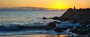 Preview wallpaper silhouette, alone, rocks, sea, horizon, sunset