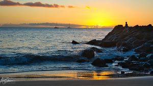 Preview wallpaper silhouette, alone, rocks, sea, horizon, sunset