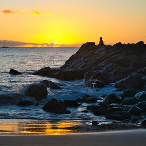 Preview wallpaper silhouette, alone, rocks, sea, horizon, sunset