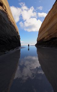 Preview wallpaper silhouette, alone, rocks, sea, landscape