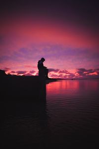 Preview wallpaper silhouette, alone, sad, sea, clouds, sunset, dark