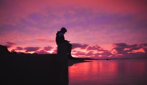 Preview wallpaper silhouette, alone, sad, sea, clouds, sunset, dark