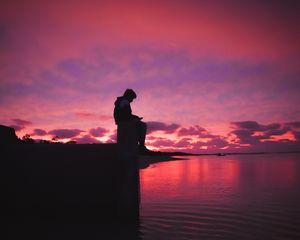 Preview wallpaper silhouette, alone, sad, sea, clouds, sunset, dark