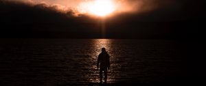 Preview wallpaper silhouette, alone, sea, sunset, dark