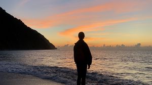 Preview wallpaper silhouette, alone, sea, beach, sunset, dark