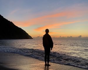 Preview wallpaper silhouette, alone, sea, beach, sunset, dark