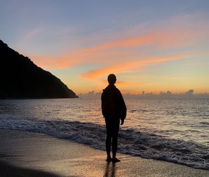 Preview wallpaper silhouette, alone, sea, beach, sunset, dark