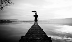 Preview wallpaper silhouette, alone, umbrella, hat, pier, water, black and white