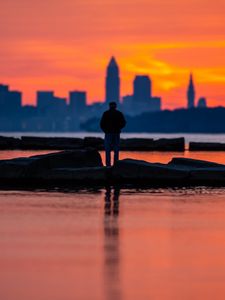 Preview wallpaper silhouette, alone, water, sunset, dark