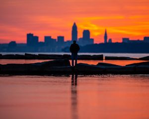 Preview wallpaper silhouette, alone, water, sunset, dark