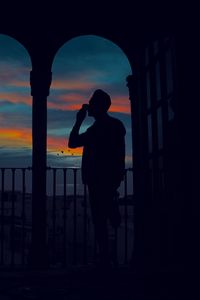Preview wallpaper silhouette, arch, twilight, dark, man