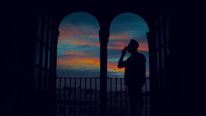 Preview wallpaper silhouette, arch, twilight, dark, man