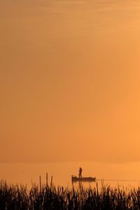 Preview wallpaper silhouette, boat, lake, lonely, fog