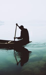 Preview wallpaper silhouette, boat, paddle, lonely, loneliness