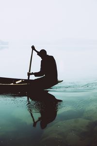 Preview wallpaper silhouette, boat, paddle, lonely, loneliness