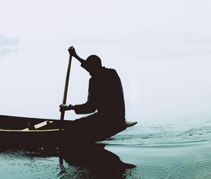 Preview wallpaper silhouette, boat, paddle, lonely, loneliness