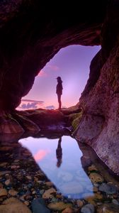 Preview wallpaper silhouette, cave, water, stones, reflection