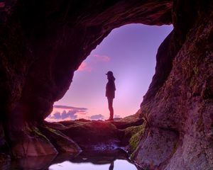 Preview wallpaper silhouette, cave, water, stones, reflection