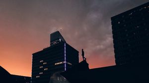 Preview wallpaper silhouette, city, buildings, sunset