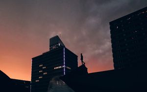 Preview wallpaper silhouette, city, buildings, sunset