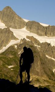 Preview wallpaper silhouette, climber, person, mountains, snow