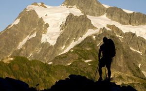 Preview wallpaper silhouette, climber, person, mountains, snow