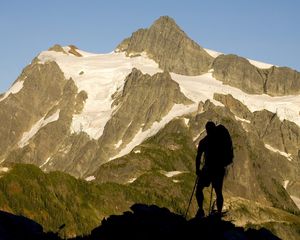 Preview wallpaper silhouette, climber, person, mountains, snow