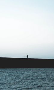 Preview wallpaper silhouette, coast, dark, sea, fisherman