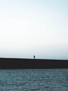 Preview wallpaper silhouette, coast, dark, sea, fisherman