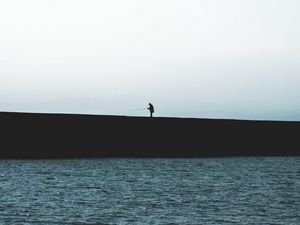 Preview wallpaper silhouette, coast, dark, sea, fisherman