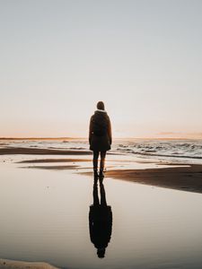 Preview wallpaper silhouette, coast, lonely, loneliness, solitude, sea