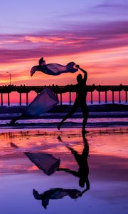 Preview wallpaper silhouette, dance, sea, pier, sunset